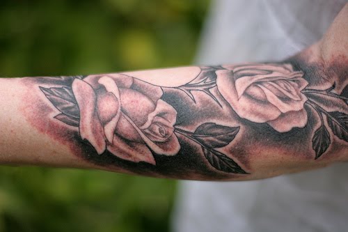two butterflies tattoo on forearm